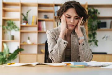 beautiful young businesswoman sitting at the office desk